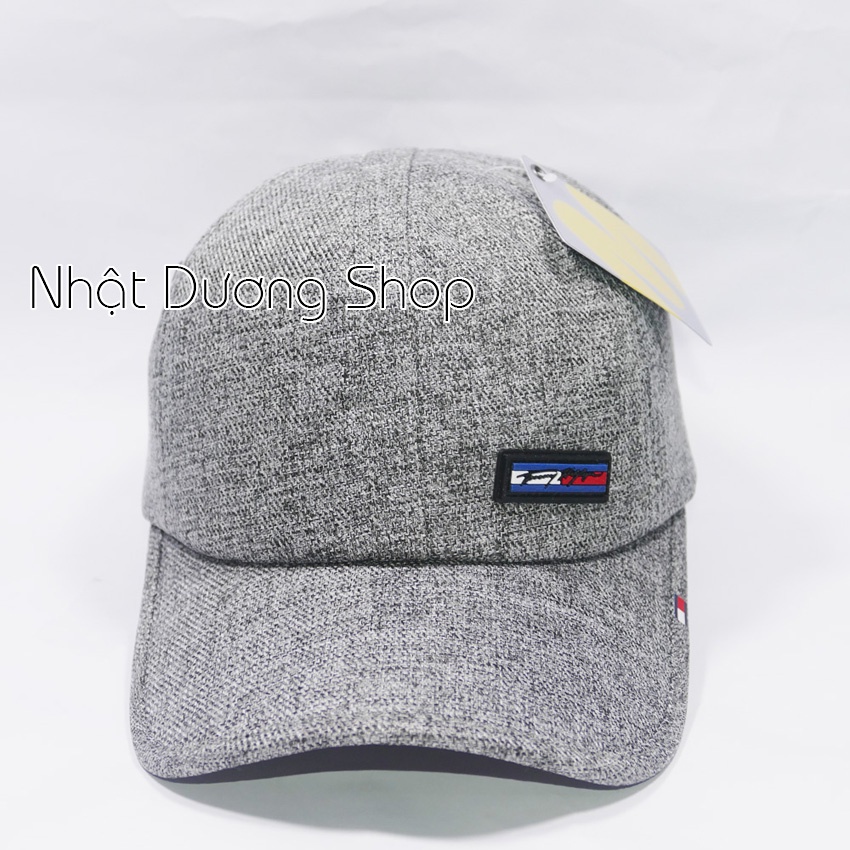 Mũ lưỡi trai mặt da ép chữ TomMy - Chất liệu vải Kaki bền chắc kết hợp với chữ ép tạo nên sự nổi bật cho người đội