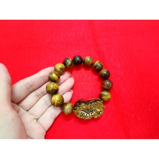 chuỗi đeo tay phong thủy đá mắt hổ mặt tỳ hưu. kích thước mỗi hạt 14mm. giá khuyến mãi 216k 1 chuỗi