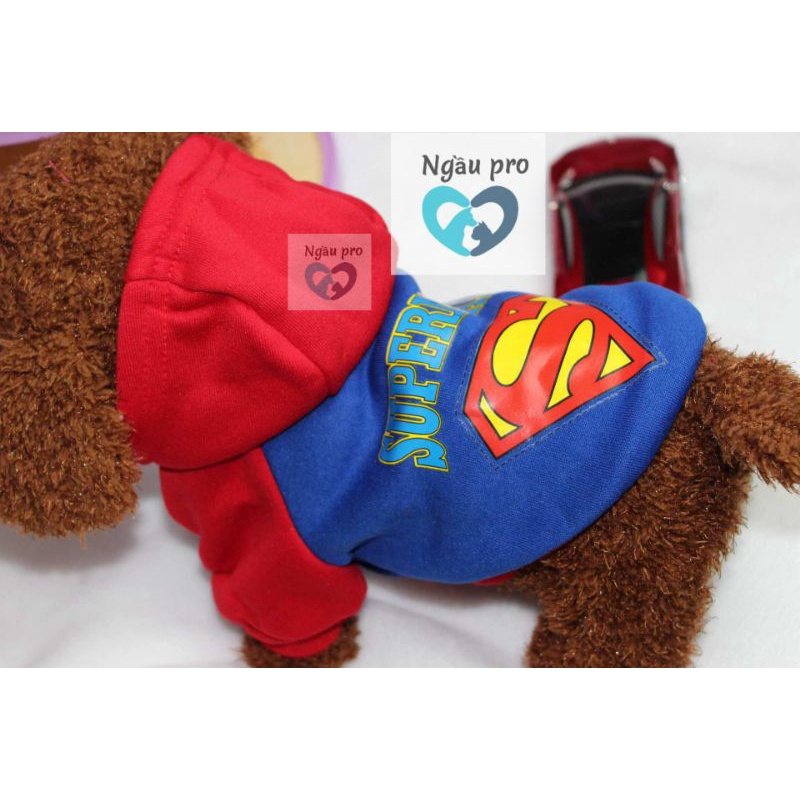 Quần áo thú cưng chó mèo con thu đông chất nỉ dài tay, Áo cho chó poodle nhỏ có mũ in hình siêu nhân dưới 10kg NGAUPET