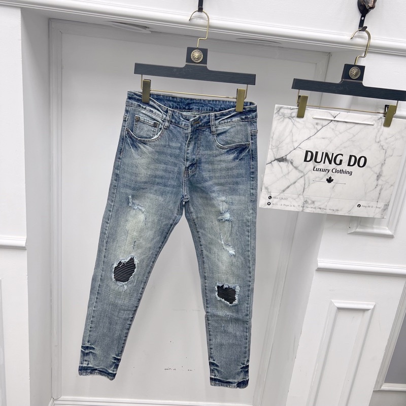 Quần jean xanh loang vá da 2 bên gối