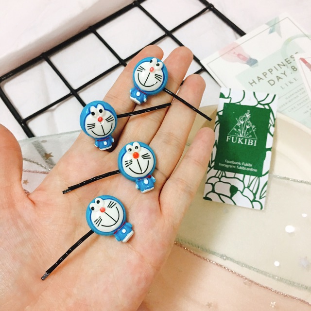 CỘT TÓC, KẸP TÓC DORAEMON ẢNH THẬT