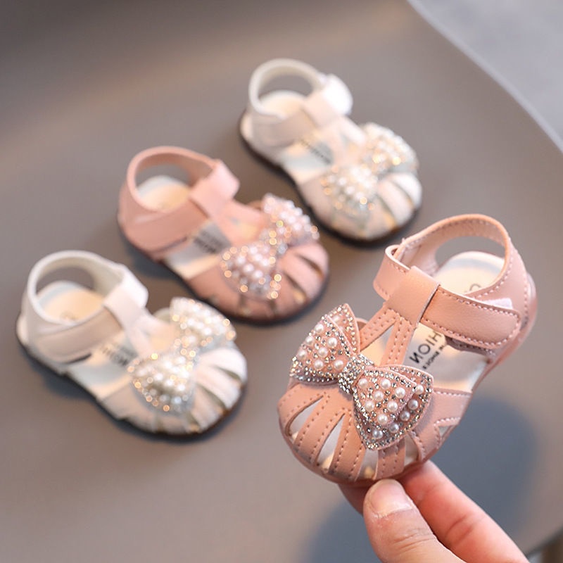 Giày búp bê đính nơ ngọc Sandal dép tập đi chống vấp êm mềm cho bé gái DTD14