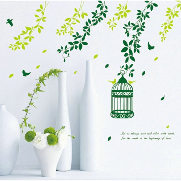 Decal trang trí tường - Những nhành cây xanh bay bay và chiếc lồng chim nhỏ