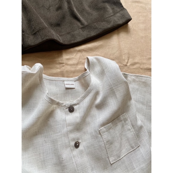 Áo sát nách hàng cúc trước