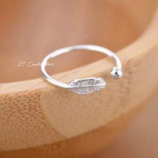 Nhẫn lông vũ bạc và xi vàng