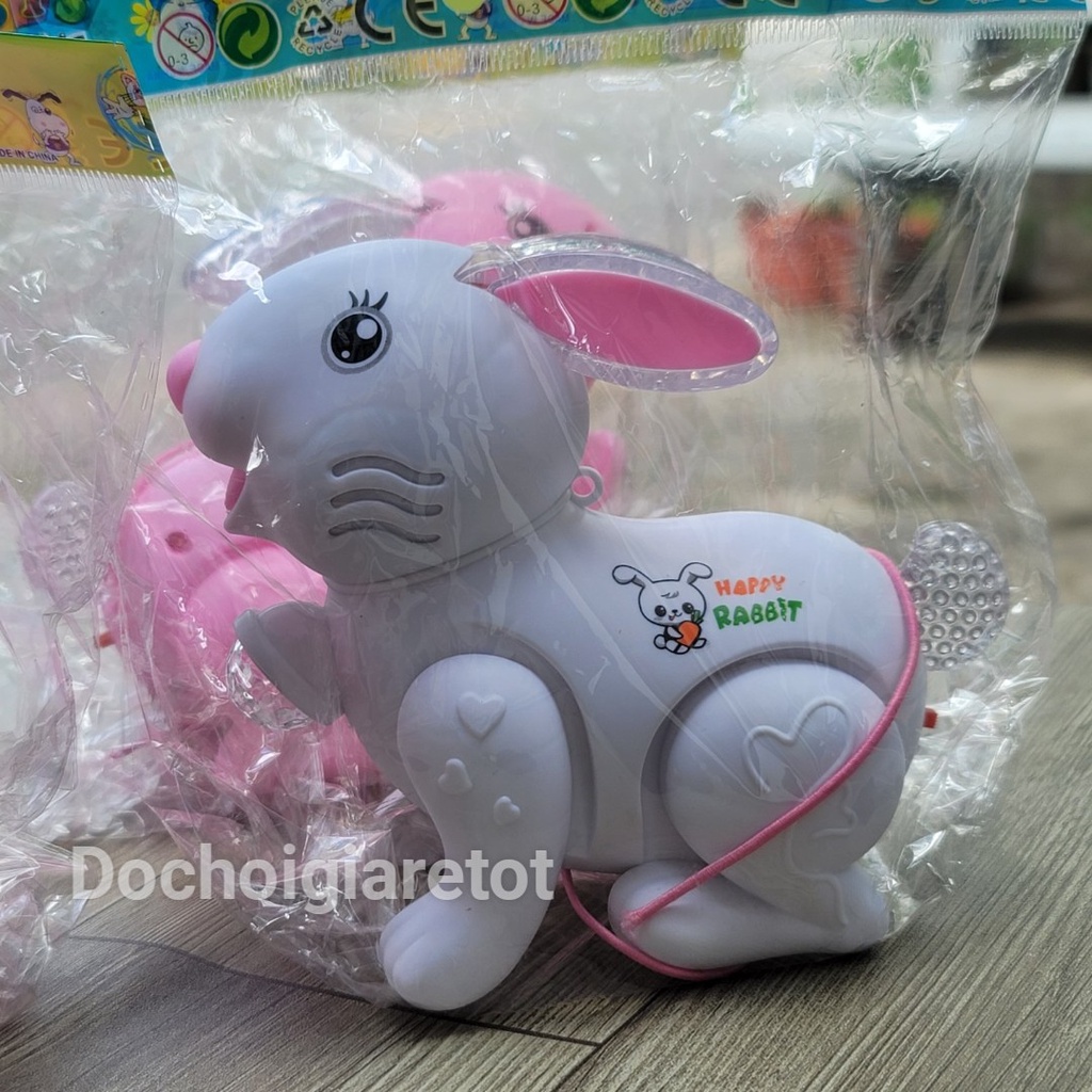 Đồ chơi con thỏ pin có nhạc đèn kèm dây dắt cho bé
