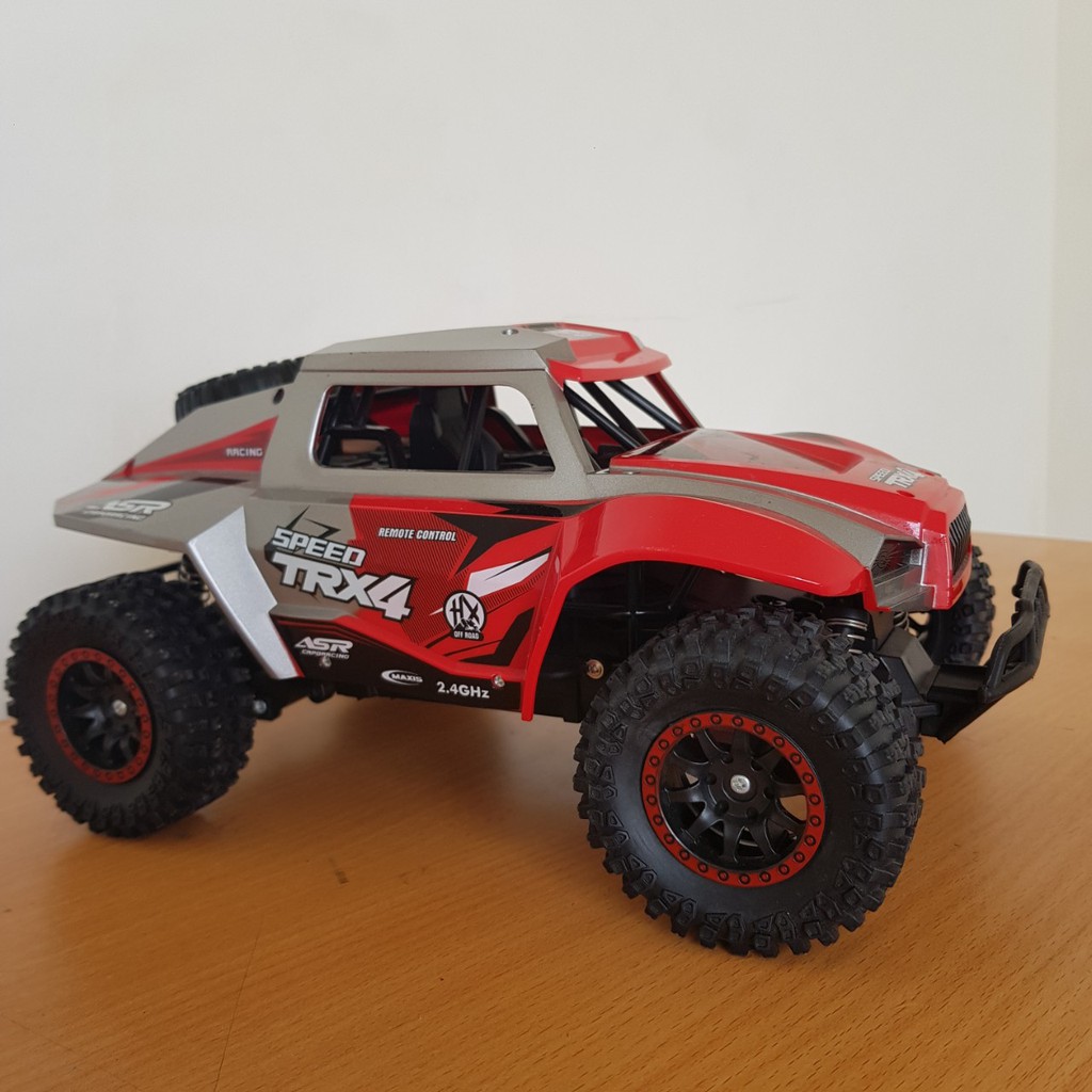 Ô TÔ ĐỊA HÌNH ĐIỀU KHIỂN TỪ XA  HIGH SPEED TRX4 2 MÀU ĐEN ĐỎ, HẦM HỐ, CHẮC CHẮN, SIÊU BỀN, BÉ SẼ THÍCH MÊ