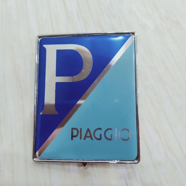 Tem mặt nạ logo Piagio gắn Vespa LX (giá 1 cái)