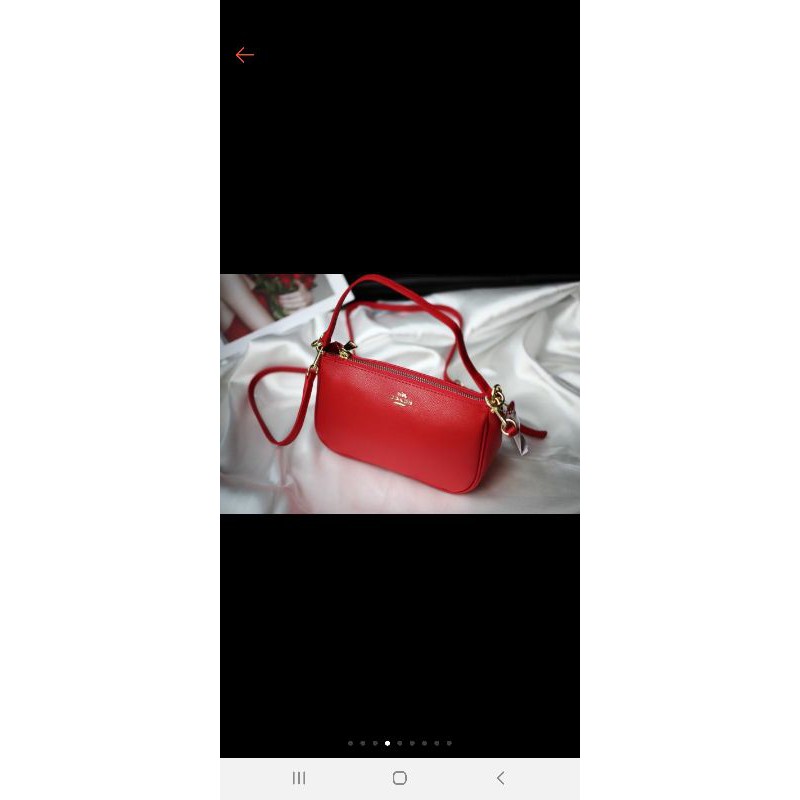 Túi cầm tay đeo chéo coach