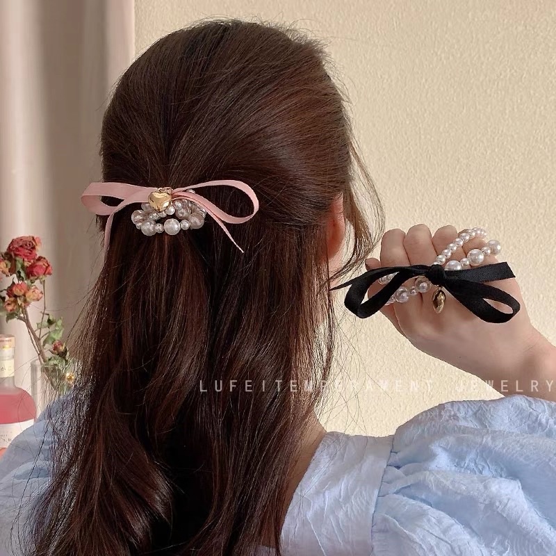 Cột tóc nơ ngọc charm tim