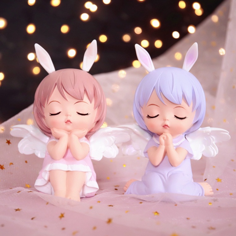 em bé ngủ thiên thần ngồi có cánh