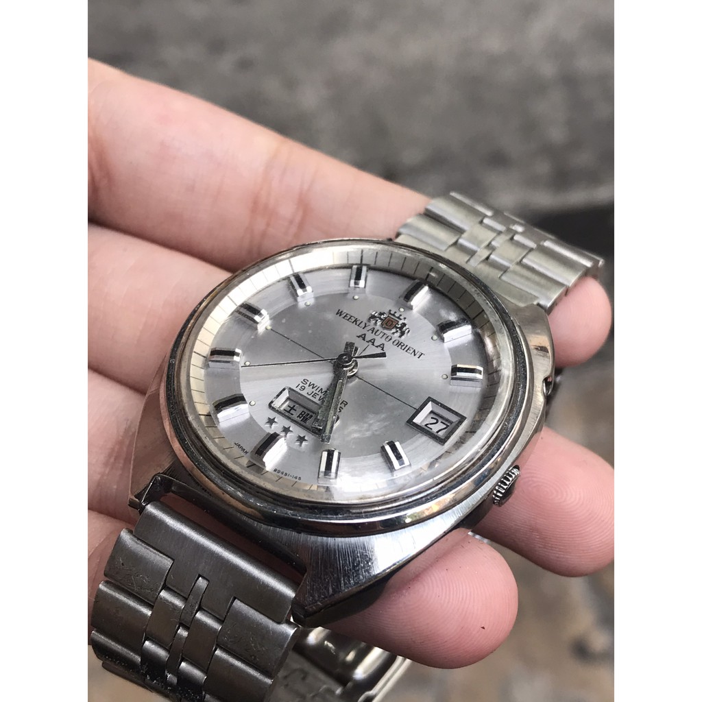 Đồng hồ nam WEEKLY AUTO ORIENT AAA cơ automatic, 19 Jewels, thiết kế mặt cười, có ô cửa lịch, dây kim loại