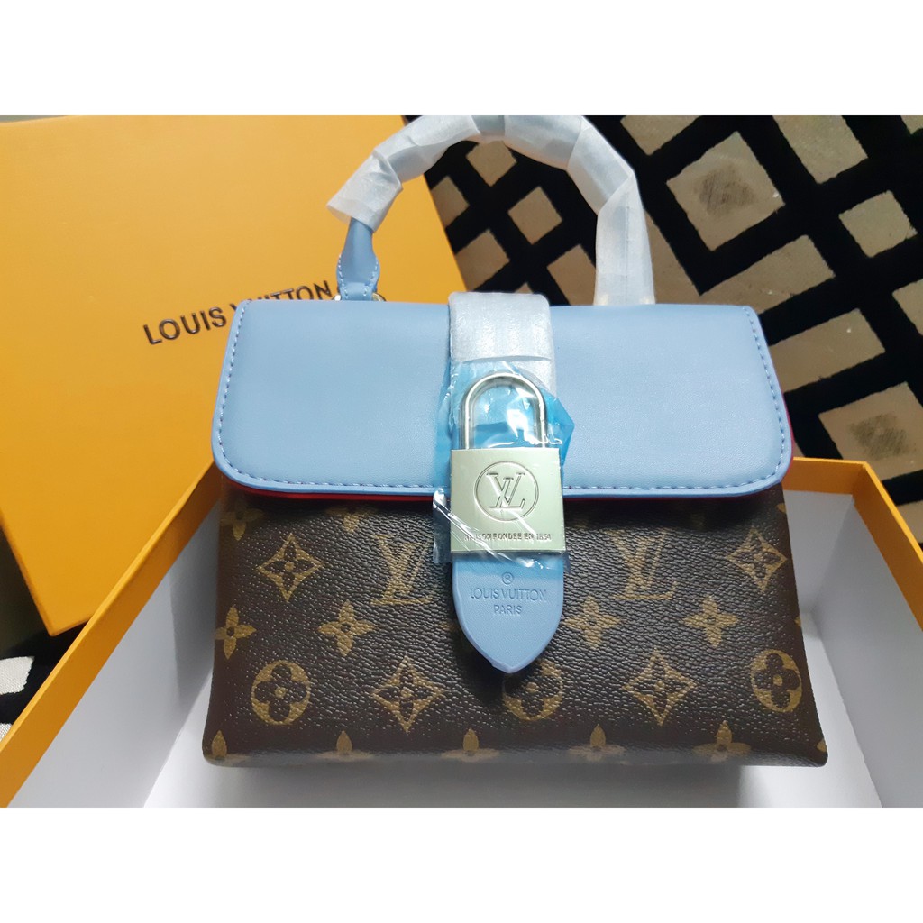 Túi xách trang trí hình ổ khóa cho chị em đi đám tiệc