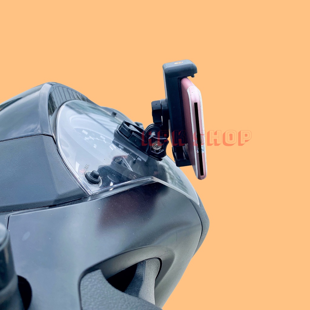 Kẹp điện thoại dán lên đồng hồ xe máy điều chỉnh hướng nhìn