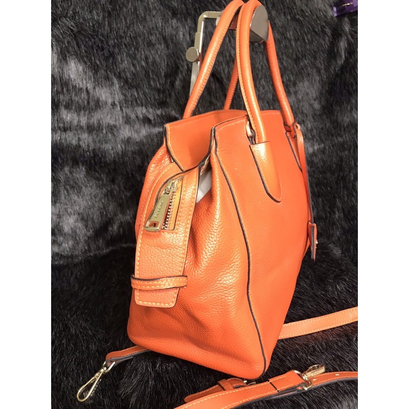 👜  Túi cầm tay, đeo chéo da thật màu cam hiệu Tucano