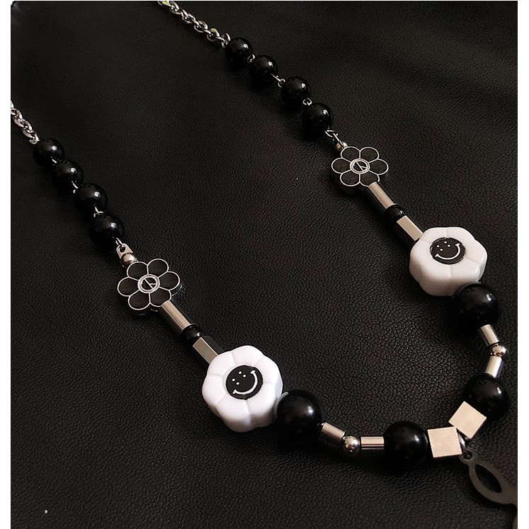 Dây chuyền titan hiphop chuỗi hoa mặt cười khóa nhạc