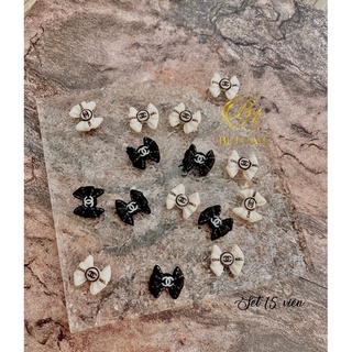 Charm nơ cha nel trắng đen 15viên