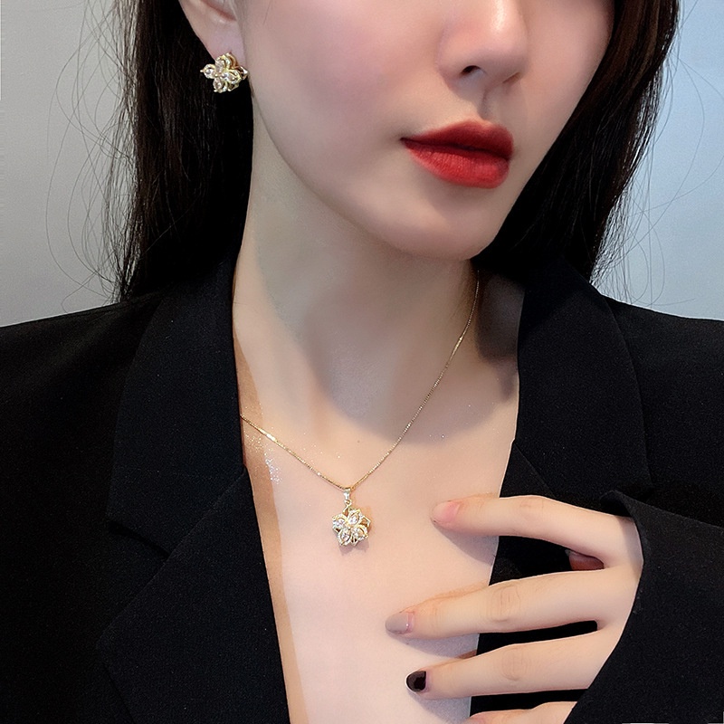 Dây chuyền/ Hoa tai/ Nhẫn mặt hoa bốn cánh đính đá zircon xoay được thời trang mùa hè dành cho bạn nữ