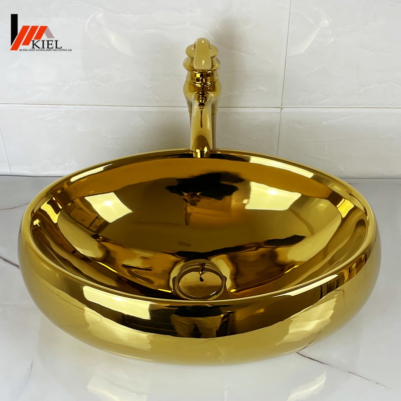 Chậu rửa lavabo elip mạ vàng cực đẹp với  độ bền cao thời gian sử dụng trên 20 năm .