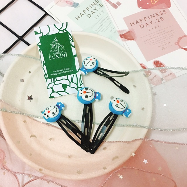 CỘT TÓC, KẸP TÓC DORAEMON ẢNH THẬT