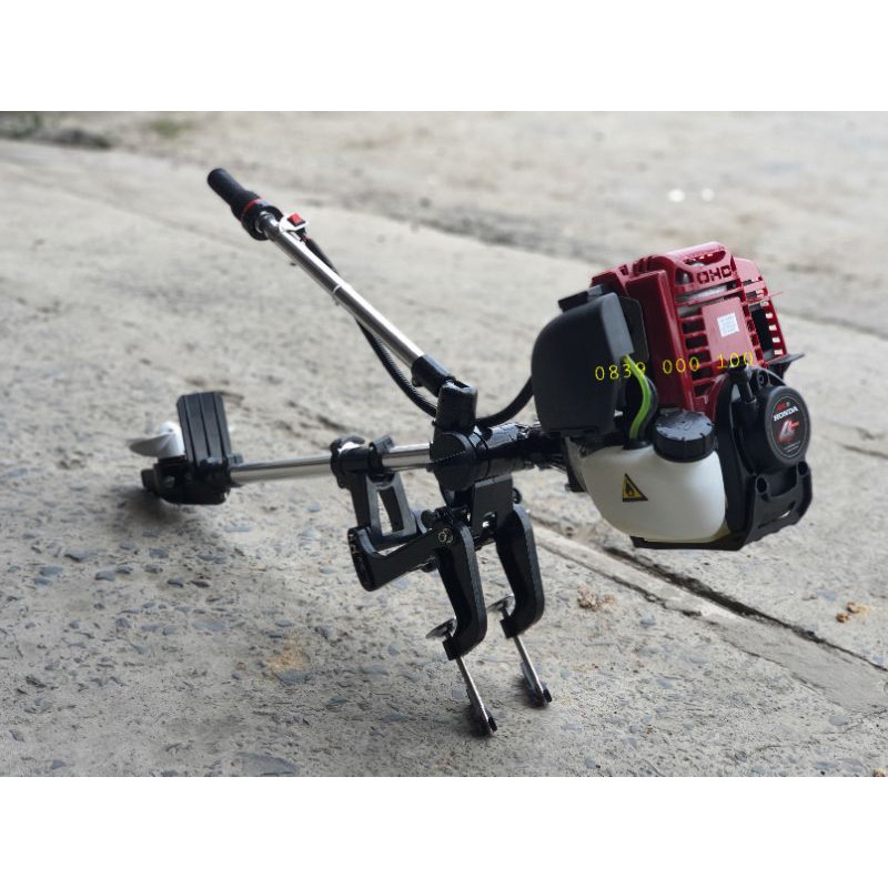 Máy cắt cỏ chạy thuyền. Máy chạy Ca No và xuồng động cơ bốn thì. Động cơ đẩy thuyền trên nước