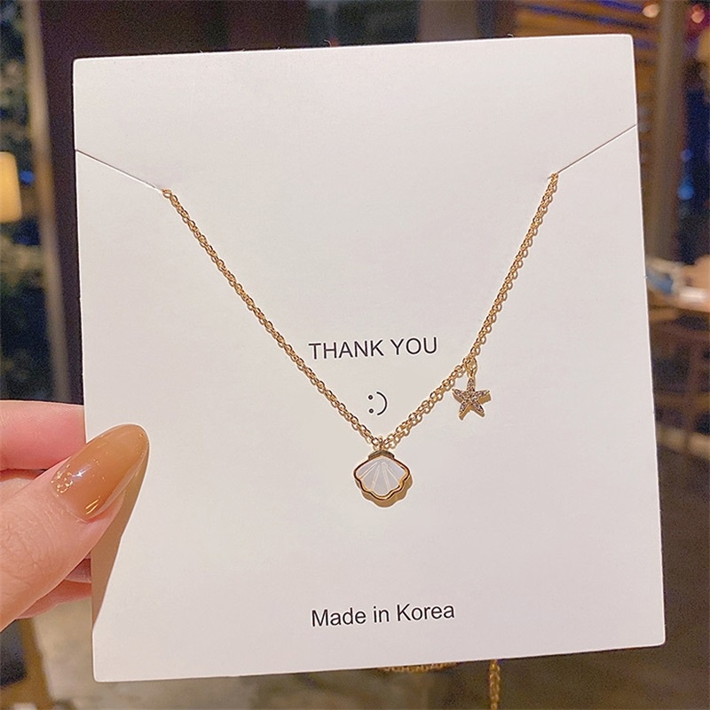 Dây chuyền thép titan mặt sao biển vỏ sò phát quang phong cách Nhật Hàn cho nữ