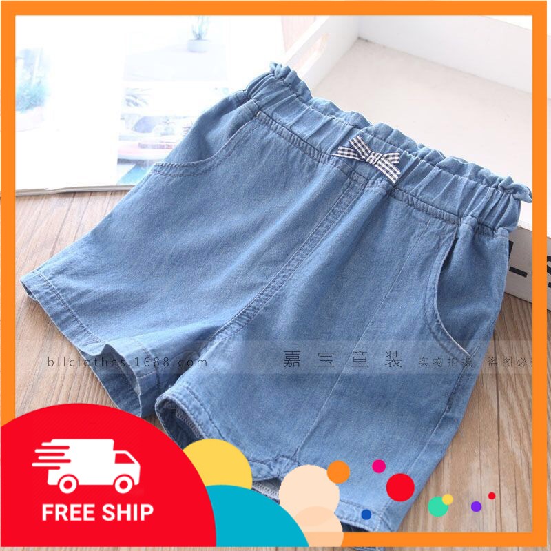 Quần jean giấy cộc đính nơ bé gái 3-12 tuổi