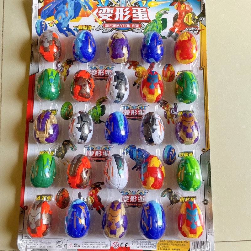 Vỉ 25 quả trứng khủng long biến hình. siêu nhân siêu đẹp của bé