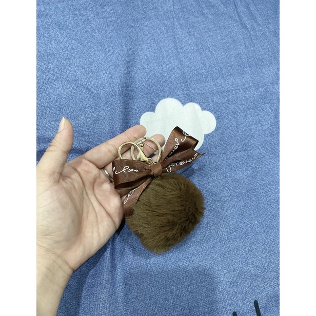 Charm bông nơ treo túi