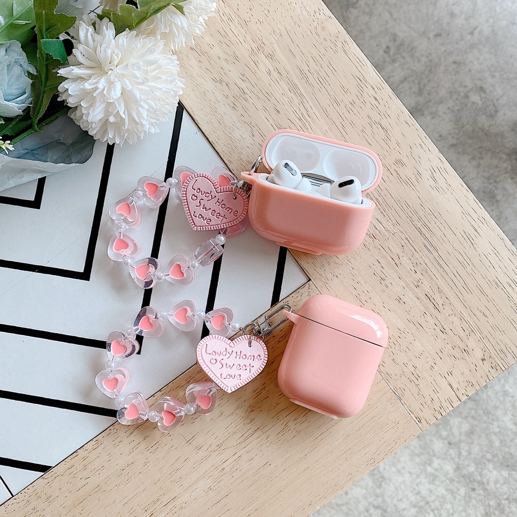 Vỏ bảo vệ hộp sạc tai nghe bluetooth airpods 1 / 2 bằng tpu mềm hình kẹo trái tim màu hồng có dây đeo chống thất lạc