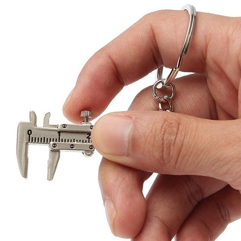 Móc khóa hình thước cặp đa năng độc đáo