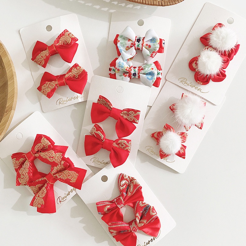 Bộ 2 kẹp tóc màu đỏ xinh xắn nhiều kiểu dáng làm quà tặng mừng năm mới cho bé gái