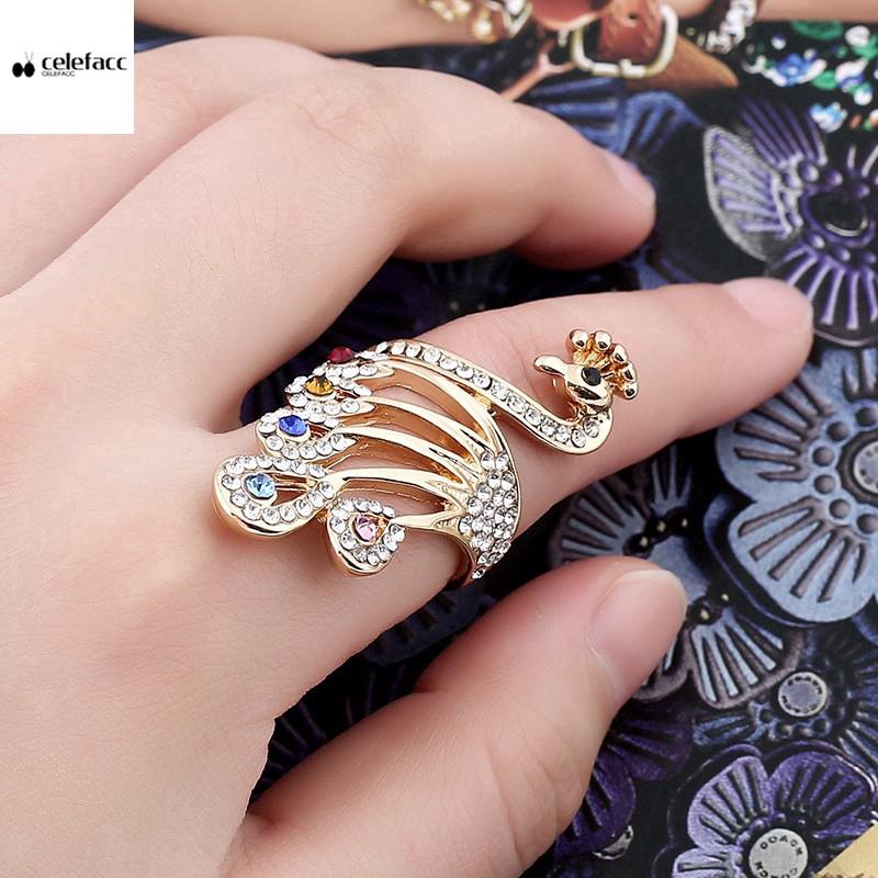 Nhẫn xi vàng hồng mặt hình con công đính đá lấp lánh