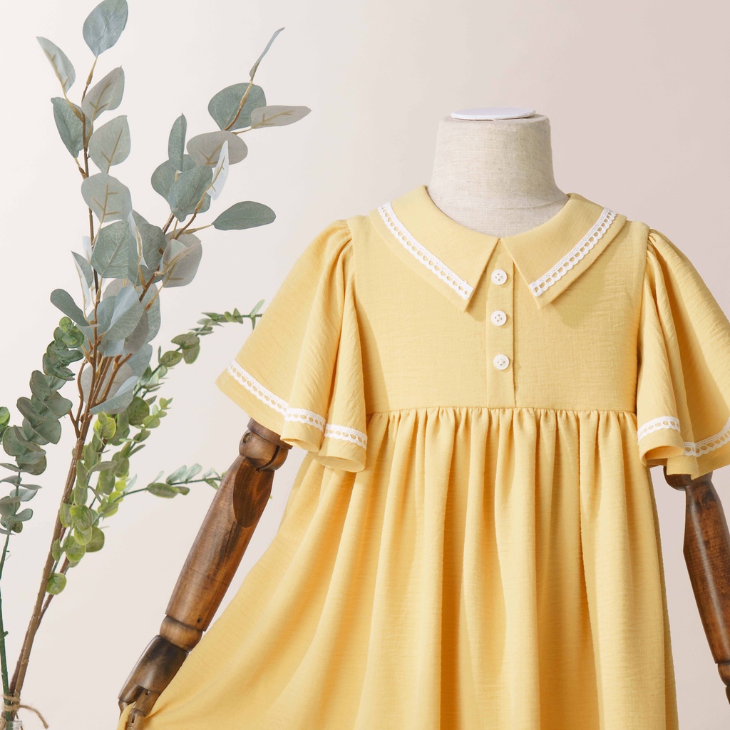 Váy Bé Gái Thiết Kế Nora Màu Vàng Nắng, Tay Áo Cánh Tiên Viền Ren BEBAE KIDSWEAR