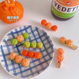 Kẹp tóc hình quả quýt độc đáo và dễ thương.