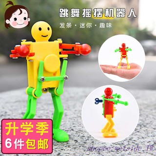 Clockwork robot on the chain dancing will move the villain cartoon children baby