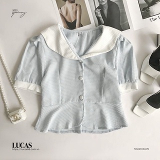 Áo sơ mi xanh ngọc cổ bẻ trắng tay bồng cộc dọc cúc bọc trắng