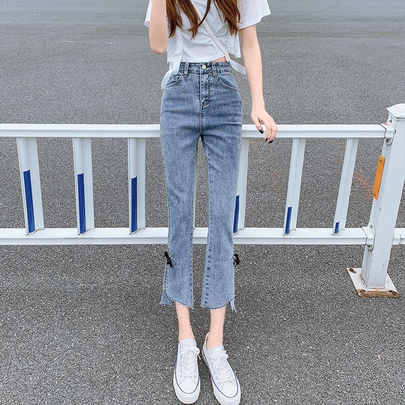 Bow stretch micro-horn forked jeans women's high waist, abdomen, body-building, nine-cent pants, thin style in summer.