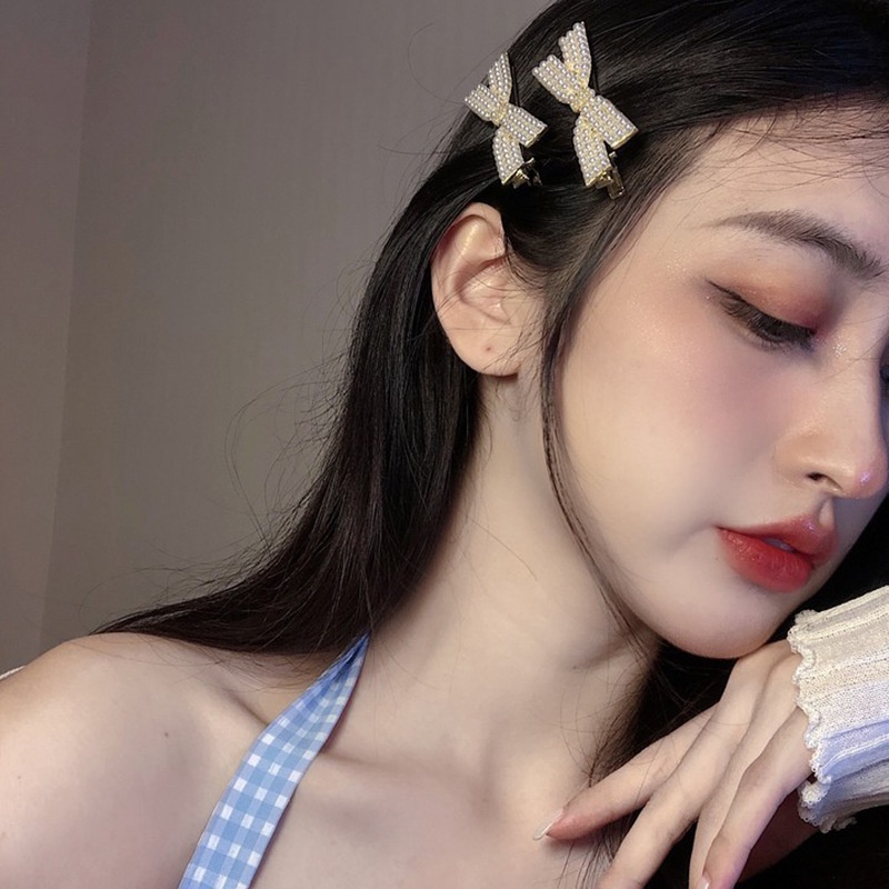 Kẹp Tóc Nơ Đan Chéo Đính Ngọc Trai Phong Cách ins Hàn Quốc