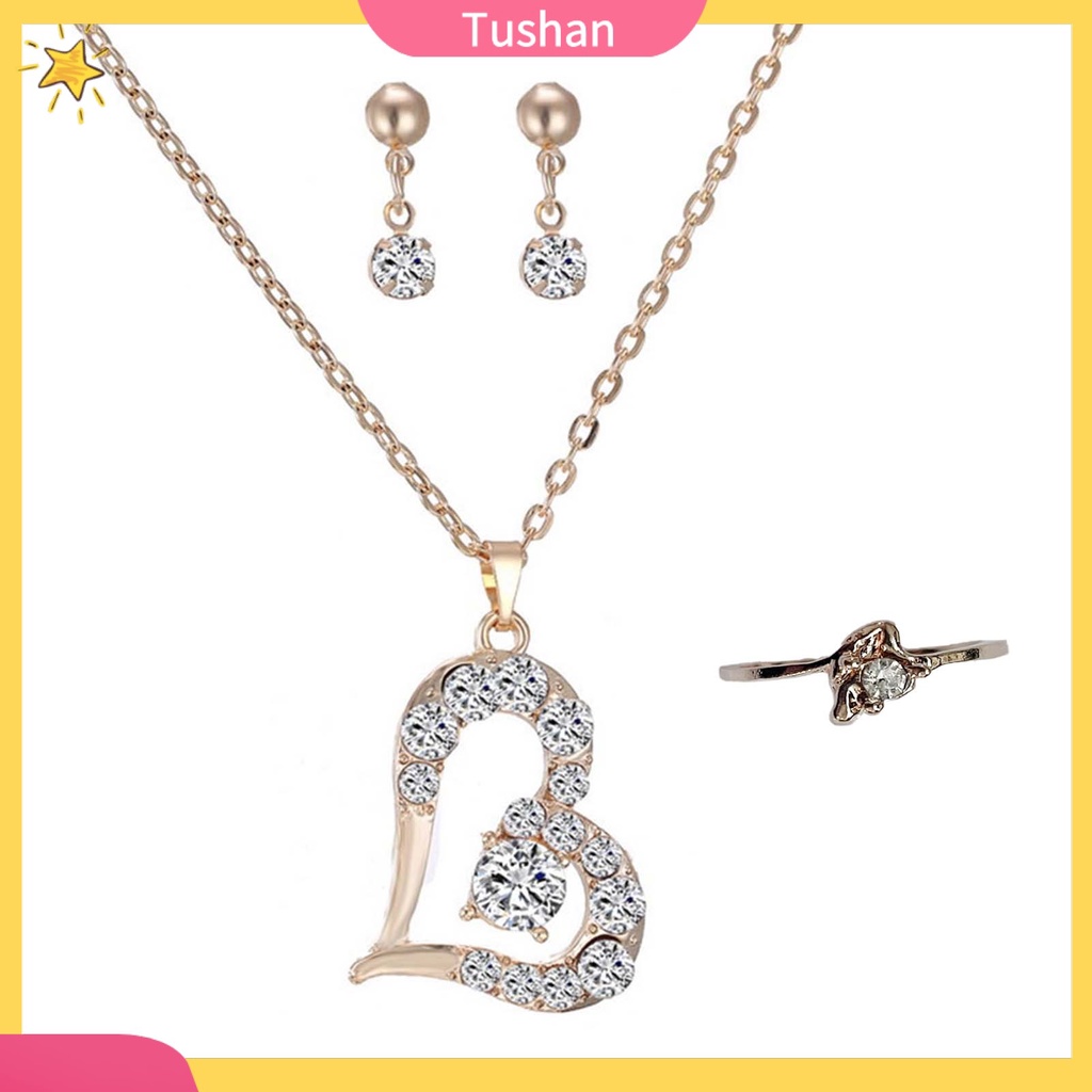 Bộ nữ trang gồm vòng cổ mặt trái tim bông tai và nhẫn đính đá pha lê sang trọng