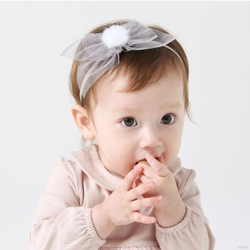 Băng đeo đầu có chi tiết quả bóng lông dễ thương cho bé