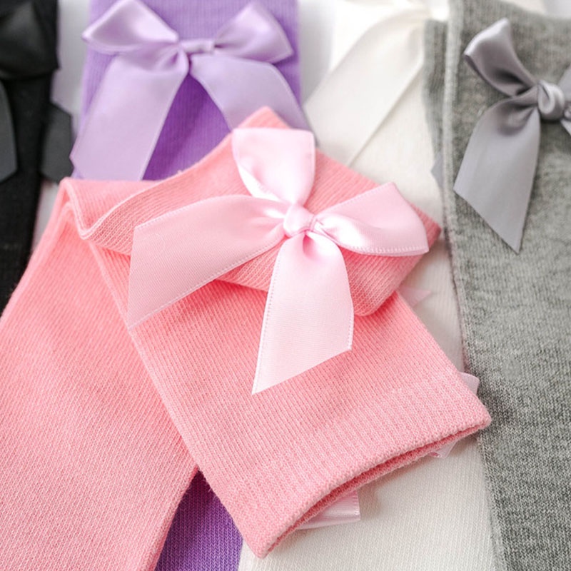 Vớ Cotton Mềm Cổ Cao Qua Gối Màu Trơn Đính Nơ Giữ Ấm Mùa Đông Cho Bé Gái