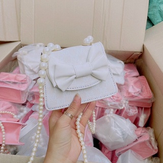 Túi đeo chéo mini nơ dây ngọc