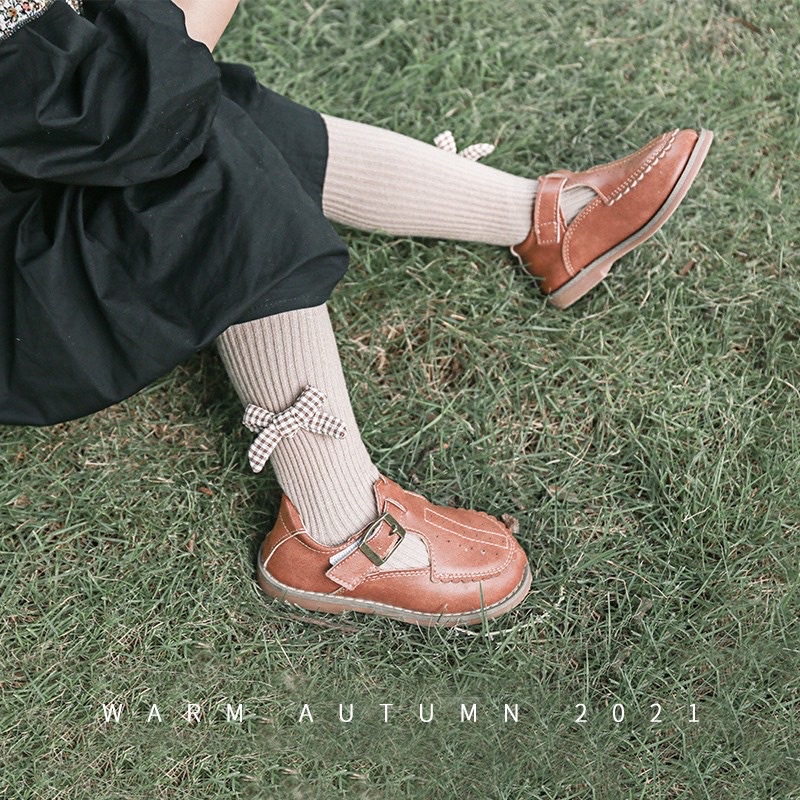 Quần vớ đính nơ caro , chất thun gân co giãn cho bé 6M-8Y