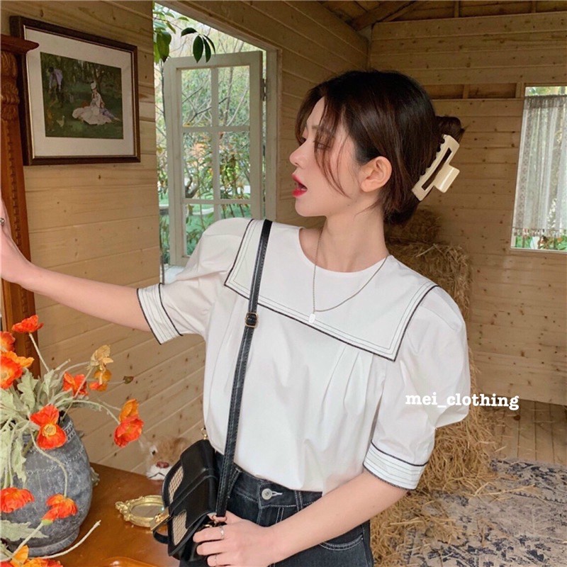Áo sơmi ngắn tay cổ vuôn viền đen