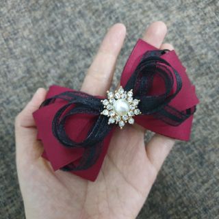 Cặp tóc nơ đính đá nổi bật