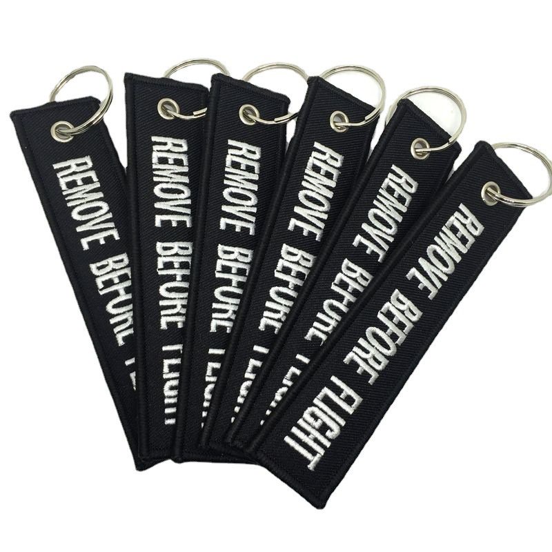 Móc chìa khóa in chữ Before Flight độc đáo