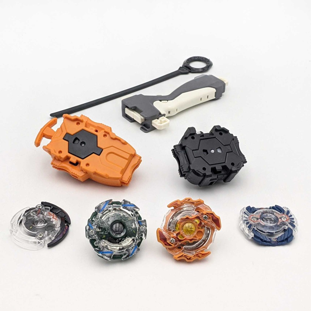 Bộ 4 Con quay BeyBlade + 2 Tay phóng + Sàn đấu - Con quay vòng xoay thần tốc