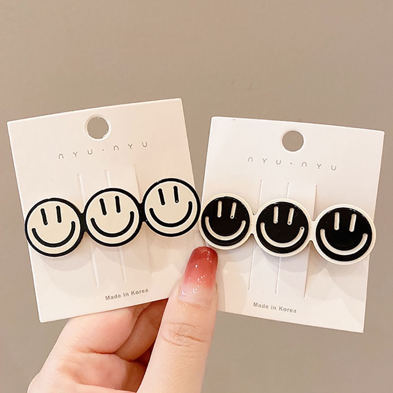 Kẹp tóc mái hình icon mặt cười cute tone màu trắng đen