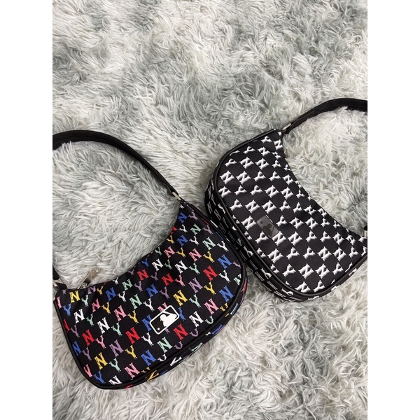 Túi kẹp nách NY TQXK hottren M.L.B Monogram  Nâu/Xanh